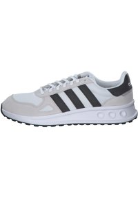 Gray and white athletic shoe featuring a mesh upper, suede accents, three black stripes, and a textured rubber sole with round cutouts.