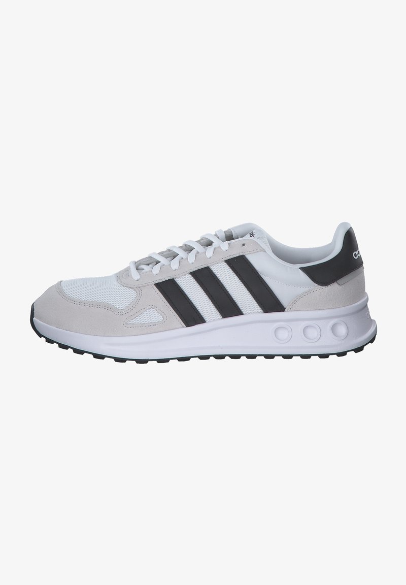 Gray and white athletic shoe featuring a mesh upper, suede accents, three black stripes, and a textured rubber sole with round cutouts.