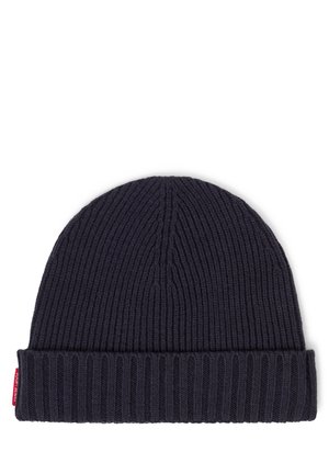 Navy knitted beanie with a ribbed texture, featuring a folded cuff and a small red label on the side.