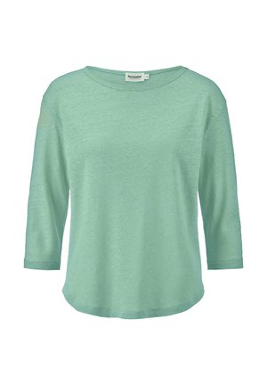 Minttu vihreä, kolmannen neljänneksen hihoilla varustettu paita, joka on tehty pehmeästä kankaasta, rento istuvuus ja pyöreä pääntie, jossa on kaareva helma ja sileä rakenne.