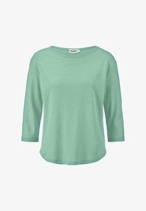 Minttu vihreä, kolmannen neljänneksen hihoilla varustettu paita, joka on tehty pehmeästä kankaasta, rento istuvuus ja pyöreä pääntie, jossa on kaareva helma ja sileä rakenne.