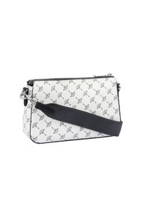 Borsa bianca con un motivo a stelle nere, una tracolla nera e una cerniera argentata, posizionata di lato per mettere in evidenza il suo design.