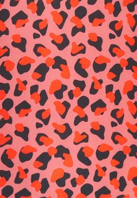 Pink fabric featuring a leopard print pattern with irregular black and bright orange shapes, creating a bold contrast. Smooth texture.