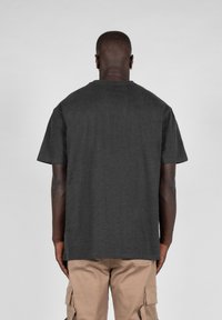 Charcoal gray short-sleeve t-shirt with a standard fit and crew neck, made of soft fabric, displayed from the back.