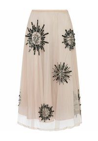 Jupe en tulle beige jusqu'aux genoux avec des embellissements noirs et argentés en motifs de rayon de soleil, dotée d'un ourlet en couches.