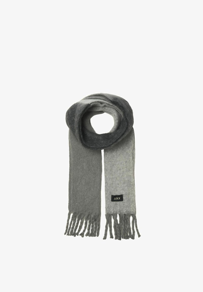 Écharpe grise et gris clair en tissu doux, avec des bordsfrangés et une petite étiquette noire avec du texte blanc.