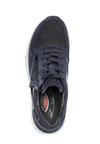 Navy leather sneaker with textured surface, round toe, laces, and zip closure; features a white sole and printed insole.