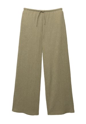Lichtgroene wijde pantalon van een gestructureerde ribstof, met een elastische tailleband en een koorddetail voor een verstelbare pasvorm.