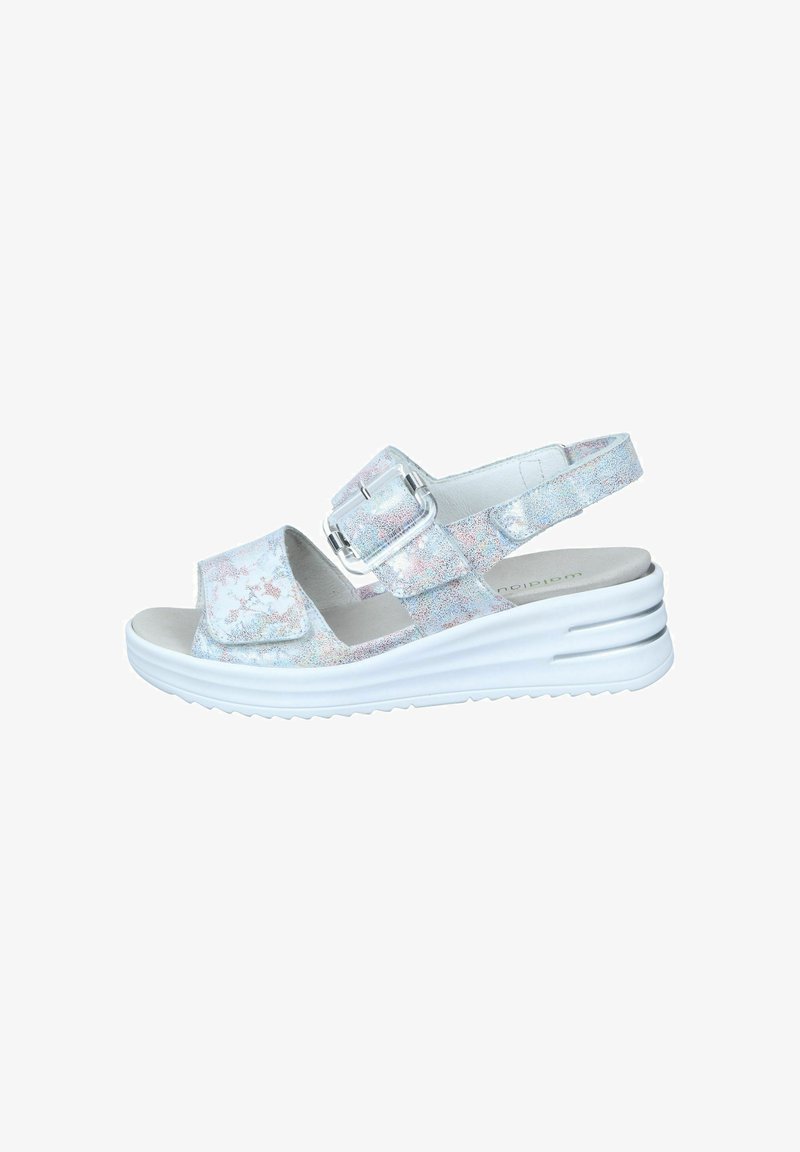 Sandal with a shiny, iridescent strap, white cushioned sole, adjustable buckle, and open toe design. Flat platform with textured grip.