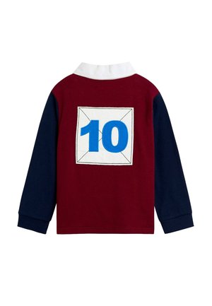 Langærmet rugbytrøje med marineblå ærmer, burgunderfarvet krop, hvid krave og stort blåt nummer 10 i en hvid firkant på ryggen.