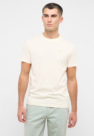 Cream-colored short-sleeve t-shirt with a round neckline and a small, embossed "MUSTANG" logo on the chest. Soft, smooth texture.