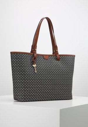 Sac fourre-tout à motif noir et blanc avec anses et garniture en cuir marron, orné d'un petit charme clé doré suspendu à une des anses.