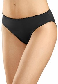 Mutande di stile bikini nere con bordi ondulati, realizzate in tessuto morbido. Il design enfatizza una vestibilità a vita bassa e una copertura minima.