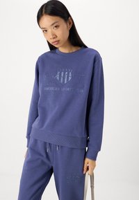 GANT TONAL SHIELD - Treniņtērpa apakšdaļas - dusty navy