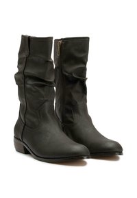 Black faux leather knee-high boots with a slouched design, pointed toe, side zipper, and a low stacked heel.