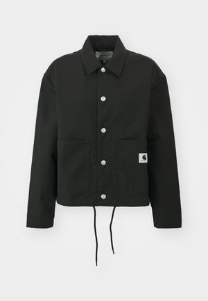 Black cropped jacket made of durable fabric. Features a classic collar, silver snap buttons, two front pockets, and adjustable drawstring hem.