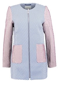 Fitted coat featuring blue geometric patterns, pink textured sleeves, two front patch pockets, and a central zipper closure.