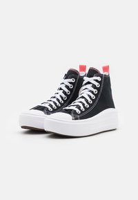 Black high-top sneakers made of canvas with white lace-up closure, white rubber sole, and pink accents on the heel tab.