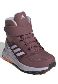 Maroon hiking boot with a lightweight, water-resistant upper, featuring a Velcro strap, textured surface, and contrasting white accents.