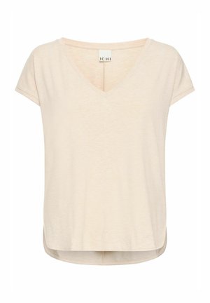 Bež majica s V-izrezom, kratkim rukavima i ravnim rubom. Lagana tkanina s blago teksturiranim završetkom i bočnim prorezima.