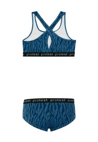 Sport bra con stampa animale blu, design a schiena scoperta e cintura nera con marchio. Il materiale presenta una morbida texture e un motivo stampato distintivo.
