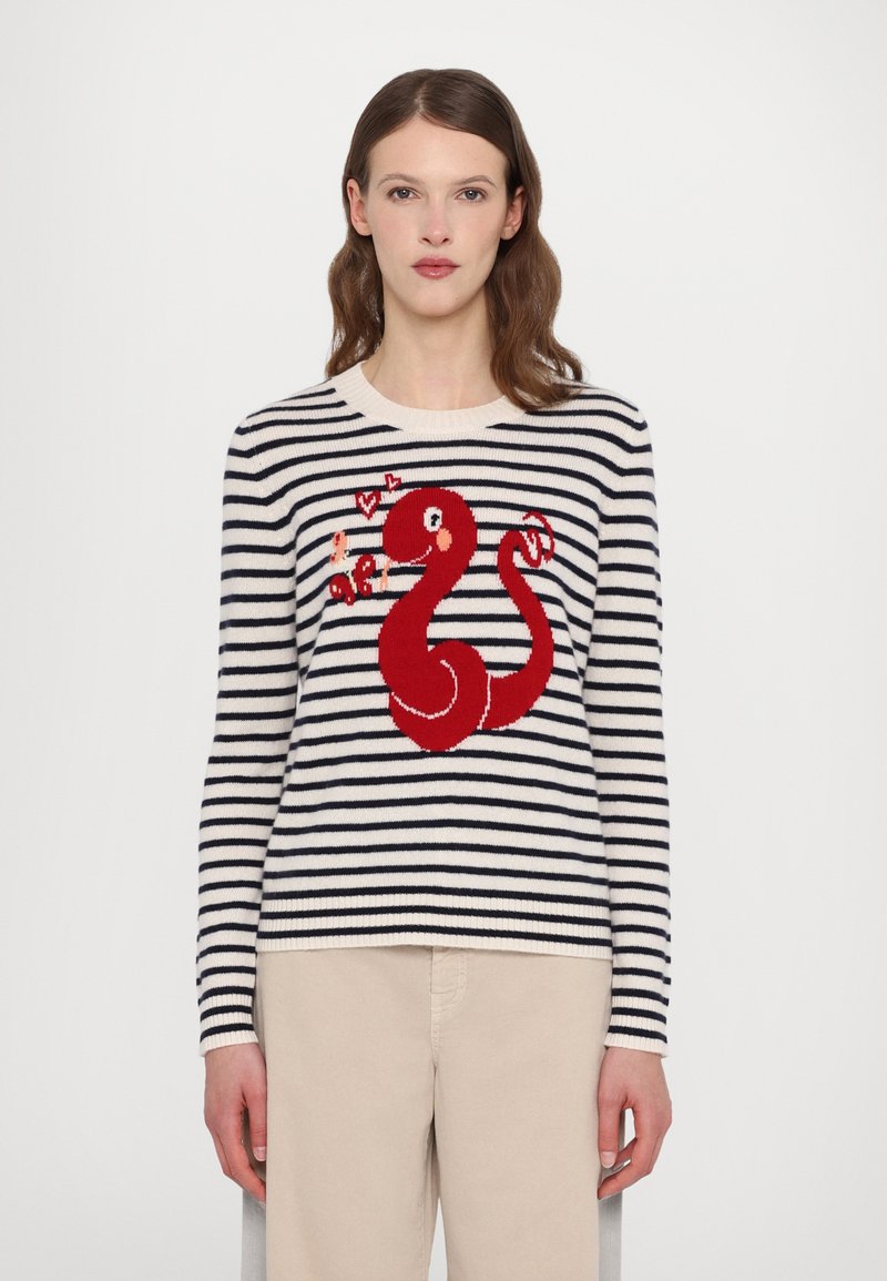 Striped knit sweater in cream and navy with a red serpent design on the front, featuring long sleeves and a round neckline.