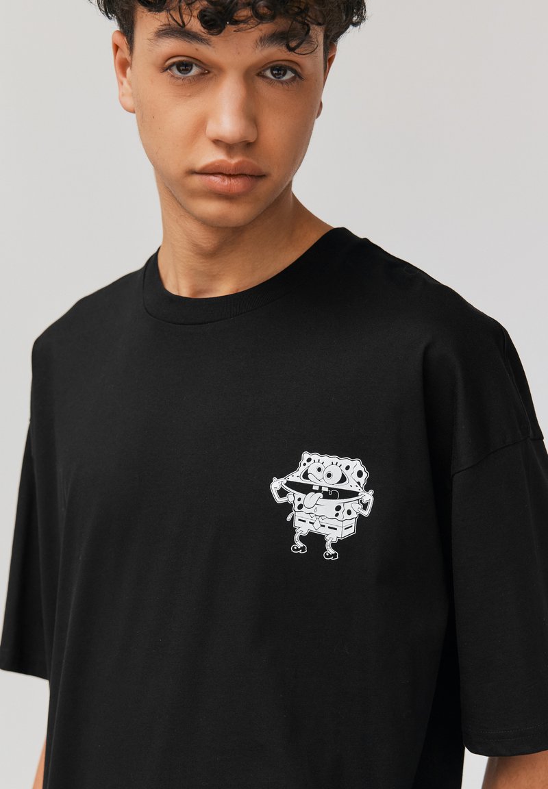 Spreadshirt Bob l'Éponge Spongebob Carlo Tantacule T Shirt Homme, S, Blanc
