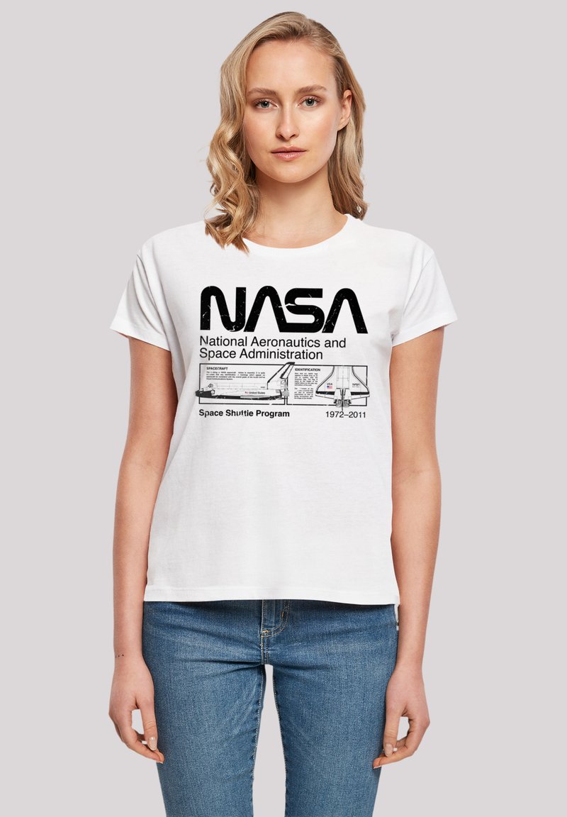 White cotton t-shirt featuring a black NASA logo, detailed text, and a graphic of a space shuttle. Casual fit with short sleeves.