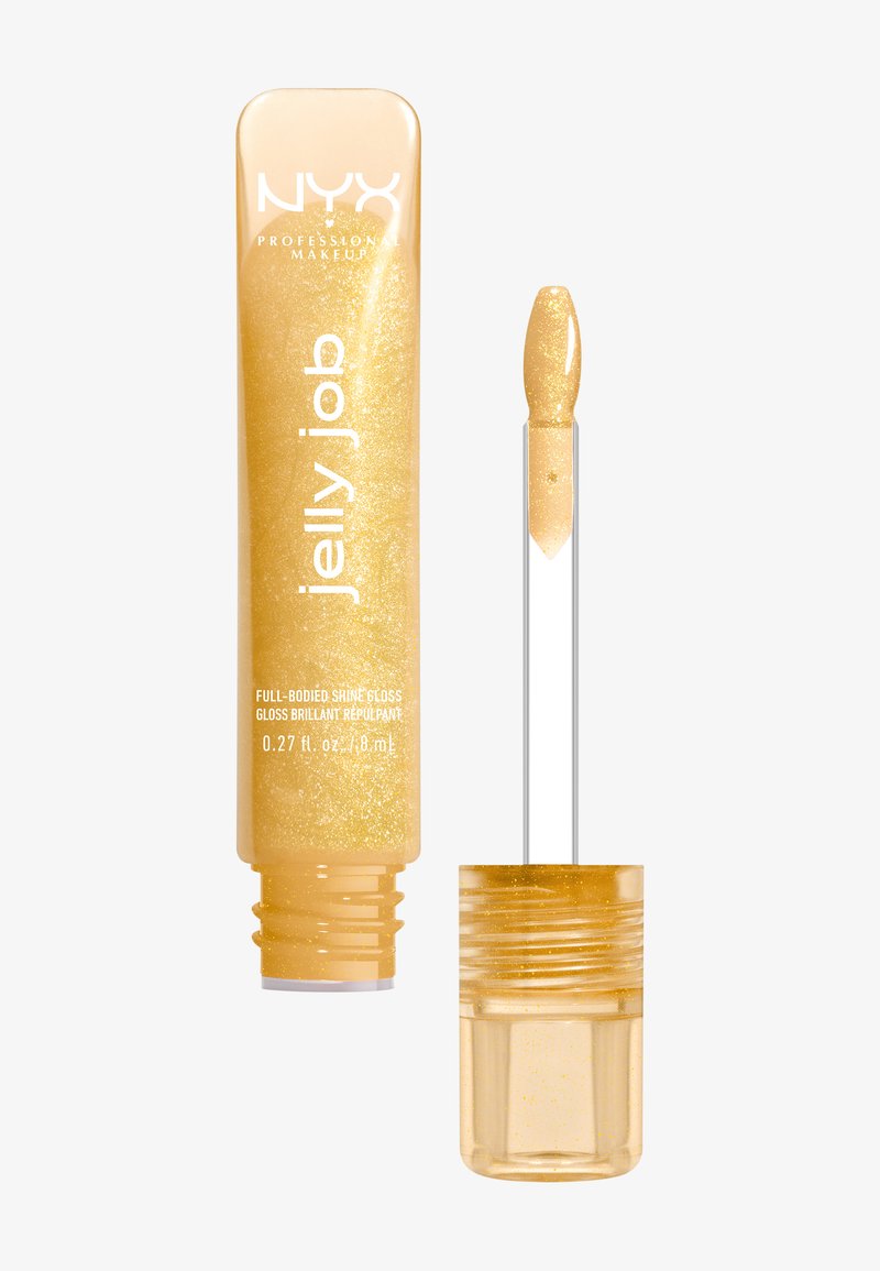 Gloss à lèvres de couleur dorée dans un tube transparent avec des paillettes scintillantes. Dispose d'un applicateur en forme de spatule pour une application précise.