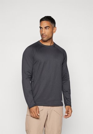 Long-sleeve athletic shirt in dark gray, made of a smooth, stretchy material with raglan sleeves and a crew neckline.