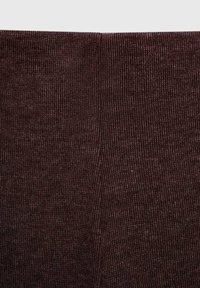 Dark brown ribbed leggings with a soft texture, featuring a high waistband and vertical stripes throughout the fabric.