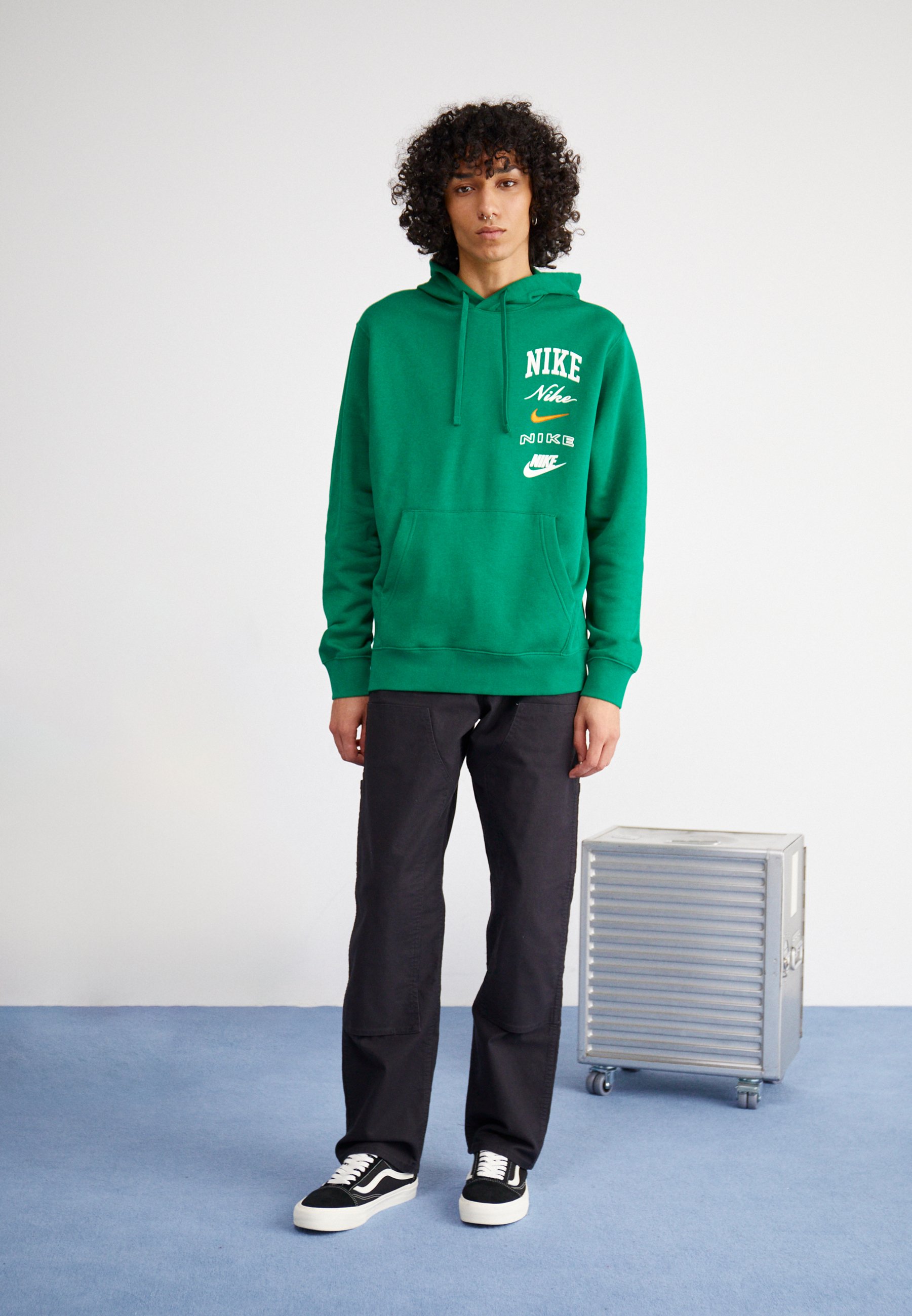 green nike hoodie with orange logo