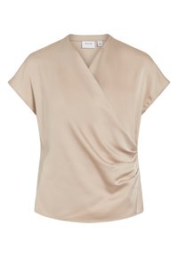 Haut beige à manches courtes en tissu lisse, avec un design drapé et un léger froncé sur le côté apportant texture et forme. Étiquette de la marque visible.