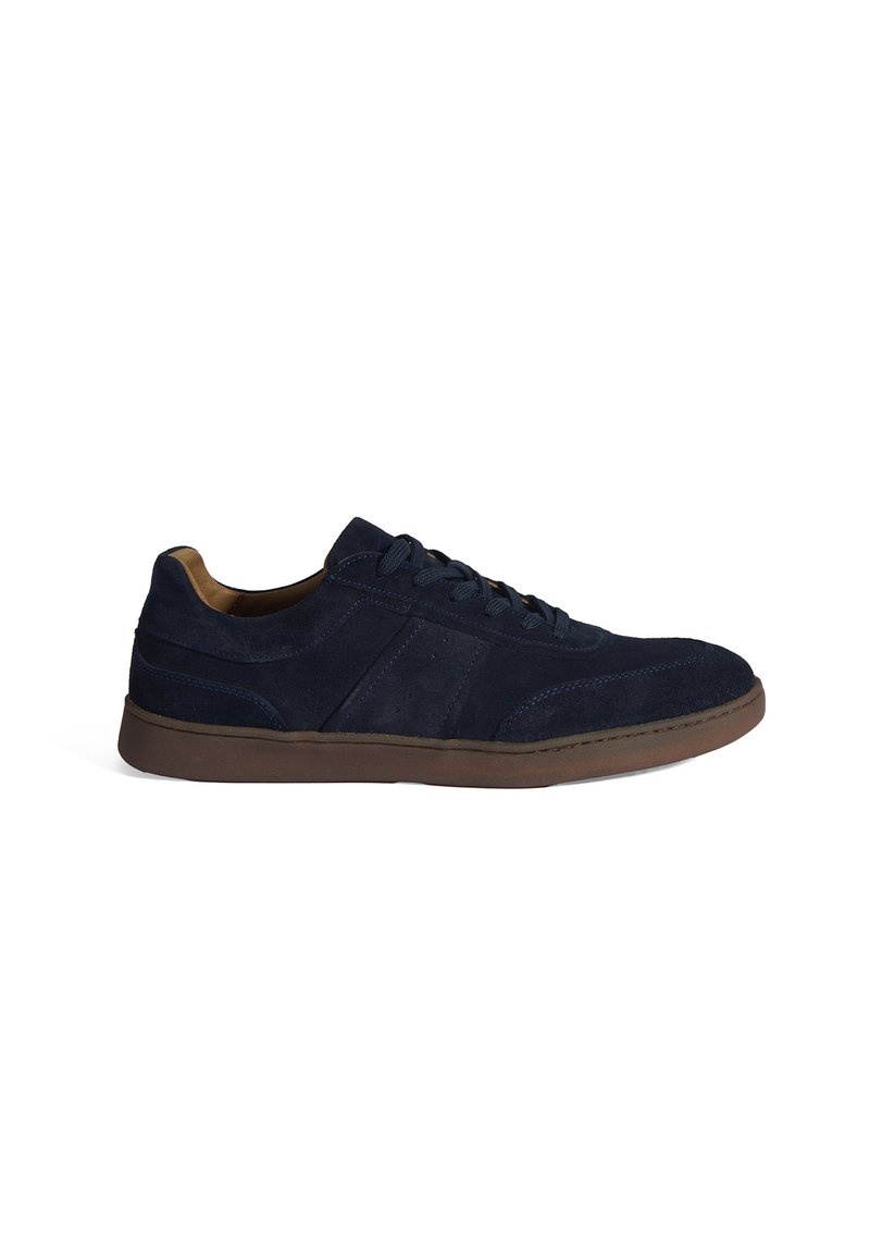 Navy blue suede sneakers with a low profile, brown rubber outsole, round toe, and lace-up design featuring tonal stitching and patterned accents.