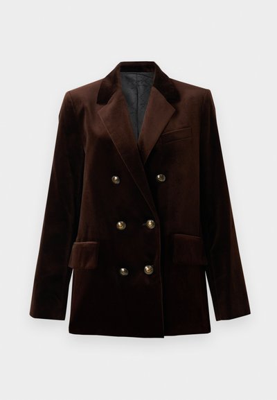 Blazer double boutonnage en velours marron avec des boutons en métal doré, des revers crantés et deux poches avant. Texture lisse et design structuré.