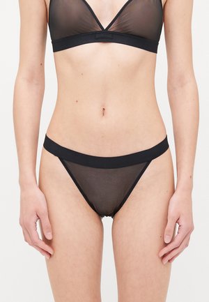 Black lingerie set featuring a sheer mesh bralette with a v-neckline and matching low-rise briefs, both with solid elastic bands.