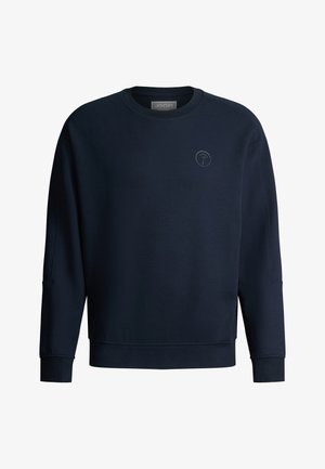 Sweat-shirt bleu marine à manches longues, col rond, avec petit logo circulaire sur le côté gauche de la poitrine, poignets et ourlet côtelés.