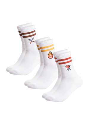 Three pairs of white crew socks with colored stripes and barbecue-themed icons: crossed spatula and fork, flaming grill, and red grill with legs.