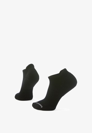 Svarta ankelsockor med ribbad textur, sömlös tåkonstruktion, förstärkt häl och elastiska muddar för en säker passform.