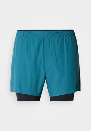 Herre treningsshorts med et ytre lag i grønnblått, svart innerfor, elastisk midjebånd og sidesplitt for bevegelsesfrihet.