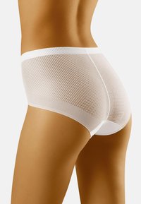 Culotte haute en maille blanche avec un motif texturé, une taille lisse et un dos arrondi. Offre une coupe ajustée et un tissu doux.