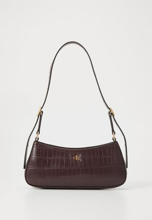 Burgundy handbag with a crocodile texture, curved shape, and a gold logo accent. Features a single strap with gold hardware.