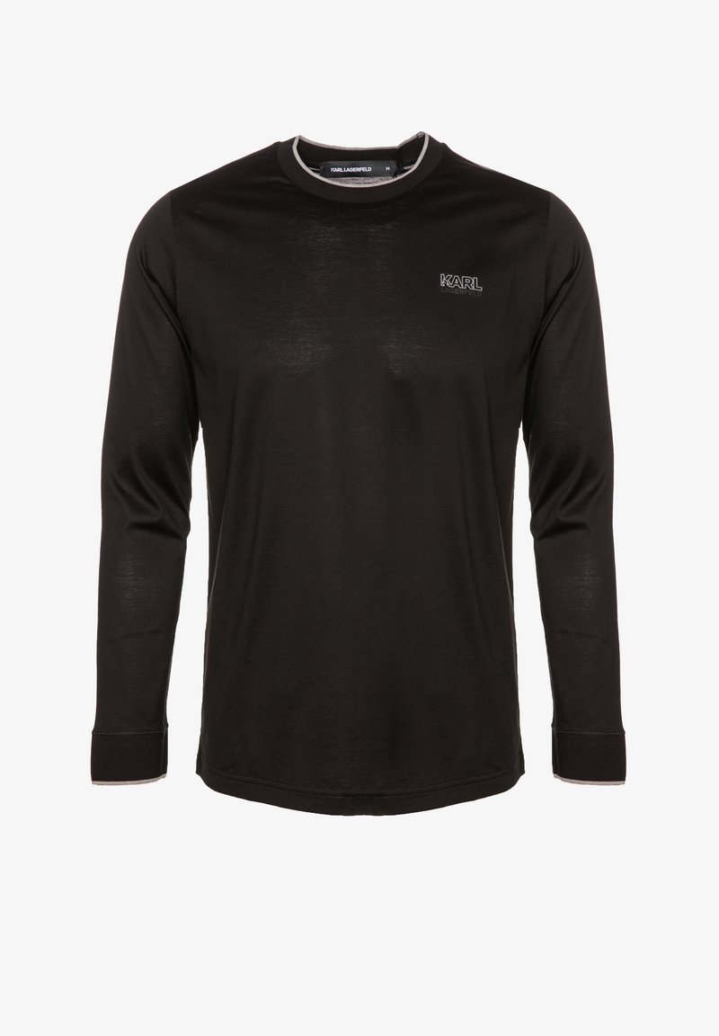 Czarna długo rękawowa koszula z miękkiego materiału, z okrągłym dekoltem i białymi przeszyciami. Logo "KARL" na lewej piersi.