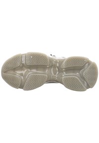 Semelle de chaussure en caoutchouc beige translucide, dotée d'un motif en zigzag texturé pour l'adhérence et le soutien.