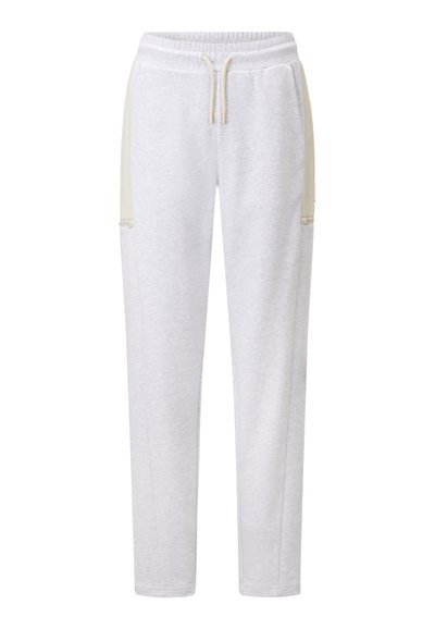Hellegraue Sweatpants aus weichem Material mit elastischem Bund und Zugband, seitlichen Taschen und kontrastierenden beigen Paneelakzenten.