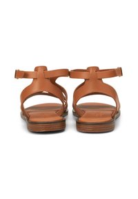 Brown leather sandals with two straps, an open heel design, and a flat wooden sole. Features minimal hardware and smooth texture.