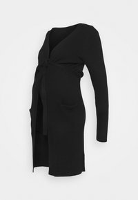 Black knitted maternity cardigan with long sleeves, V-neck, tied front, and front pockets. Features a smooth texture and a relaxed fit.