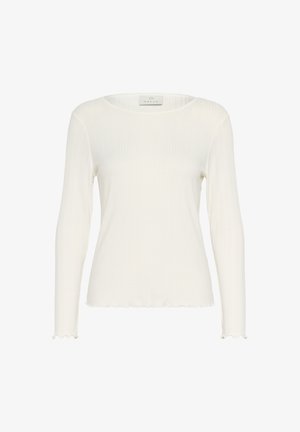 Baltas garām piedurknēm topiņš, kas izgatavots no ribotu audumu. Tam ir apaļa kakla izgriezums un viļņots apakšmalas un piedurkņu dizains, nodrošinot pieguļošu izskatu.