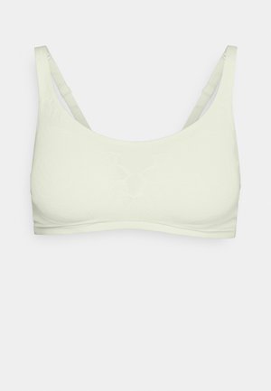 Sostén verde claro con una textura suave, tirantes anchos y un patrón floral incorporado en el diseño de la tela. Forma simple y sin costuras.