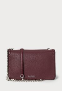 Burgundy leather crossbody bag with textured finish, silver chain strap, and front clasp. Features logo detail on the front.